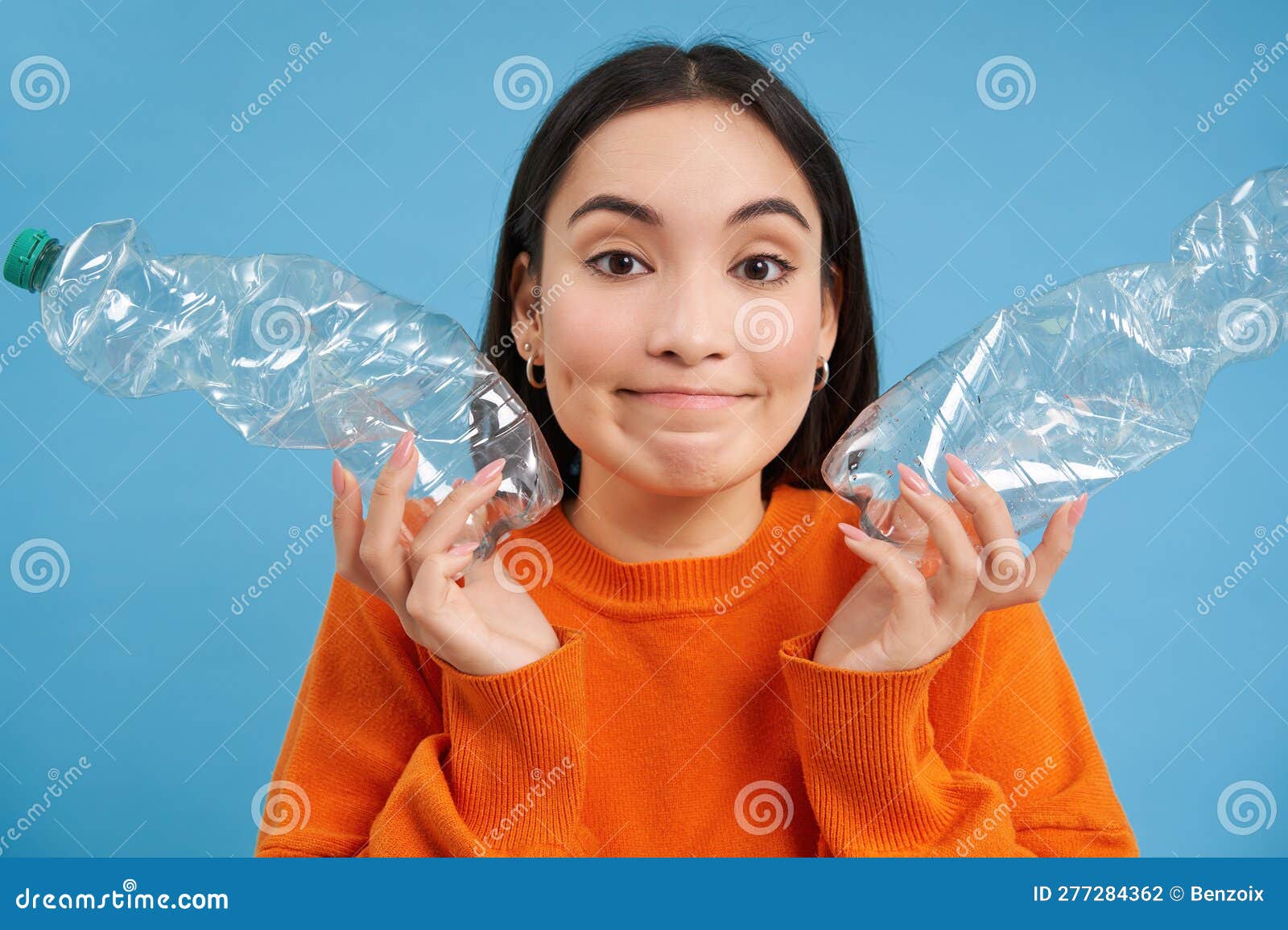 Cute Korean Woman Shows Two Plastic Bottles and Smiles, Recycles, Sorts ...