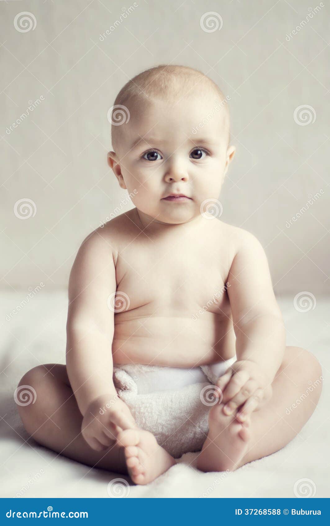 Cute Little Baby Sitting on the Bed Stock Photo - Image of life, male ...