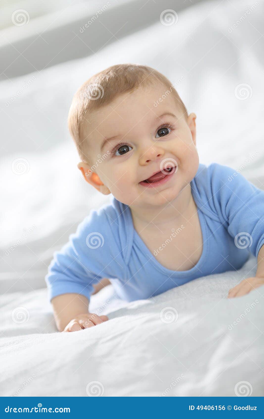 Cute Little Baby Smiling and Lying on the Bed Stock Photo - Image ...