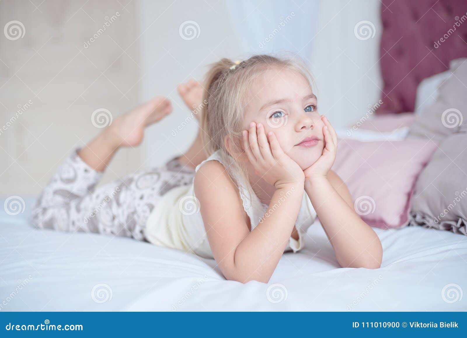 Cute Little Blond Girl Lying on Bed Stock Photo - Image of little ...