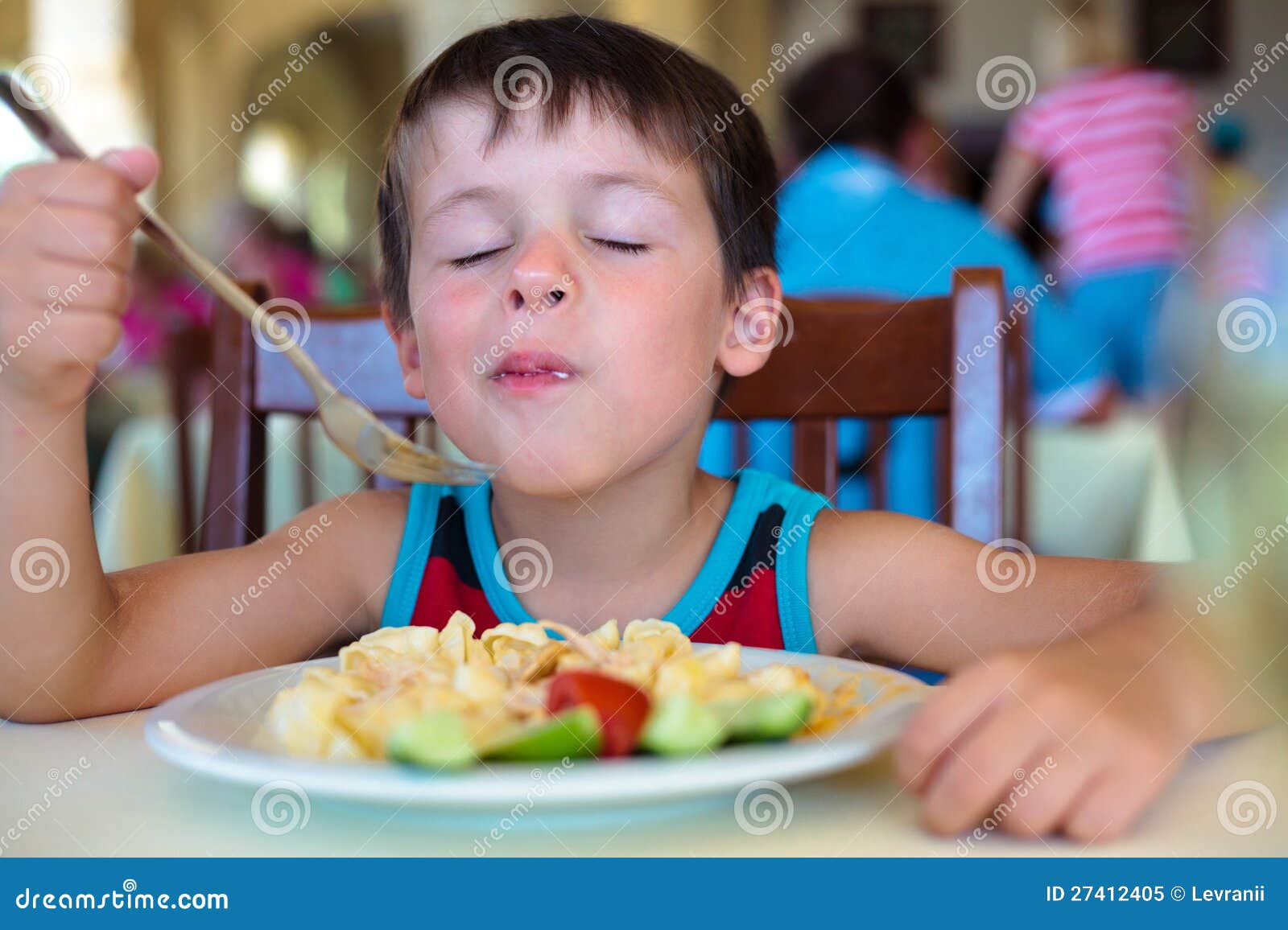 cute little boy enjoying food