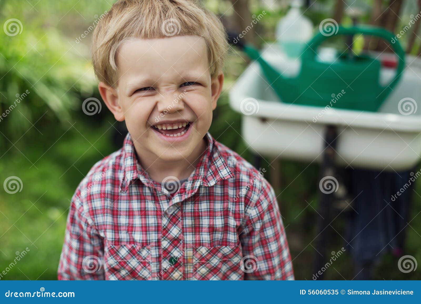 Cute little boy in garden. Outdoors portrait