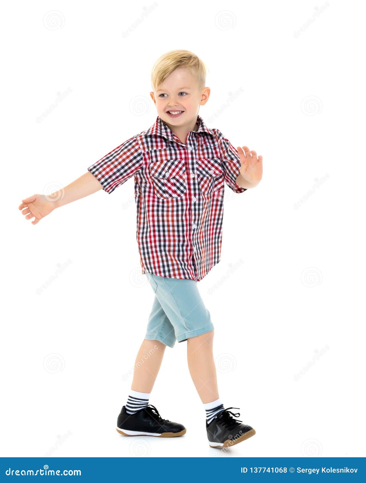 A Cute Little Boy in a Shirt and Shorts. Stock Photo - Image of hand ...