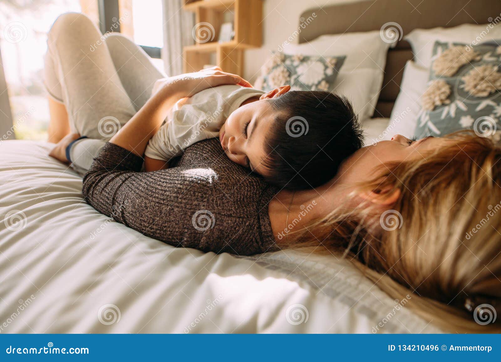 Sileping Mom San Xxx - Mother and Son Sleeping Together in Bed Stock Photo - Image of female,  napping: 134210496