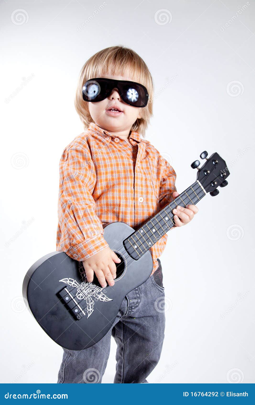 cute little boy ukulele guitar 16764292
