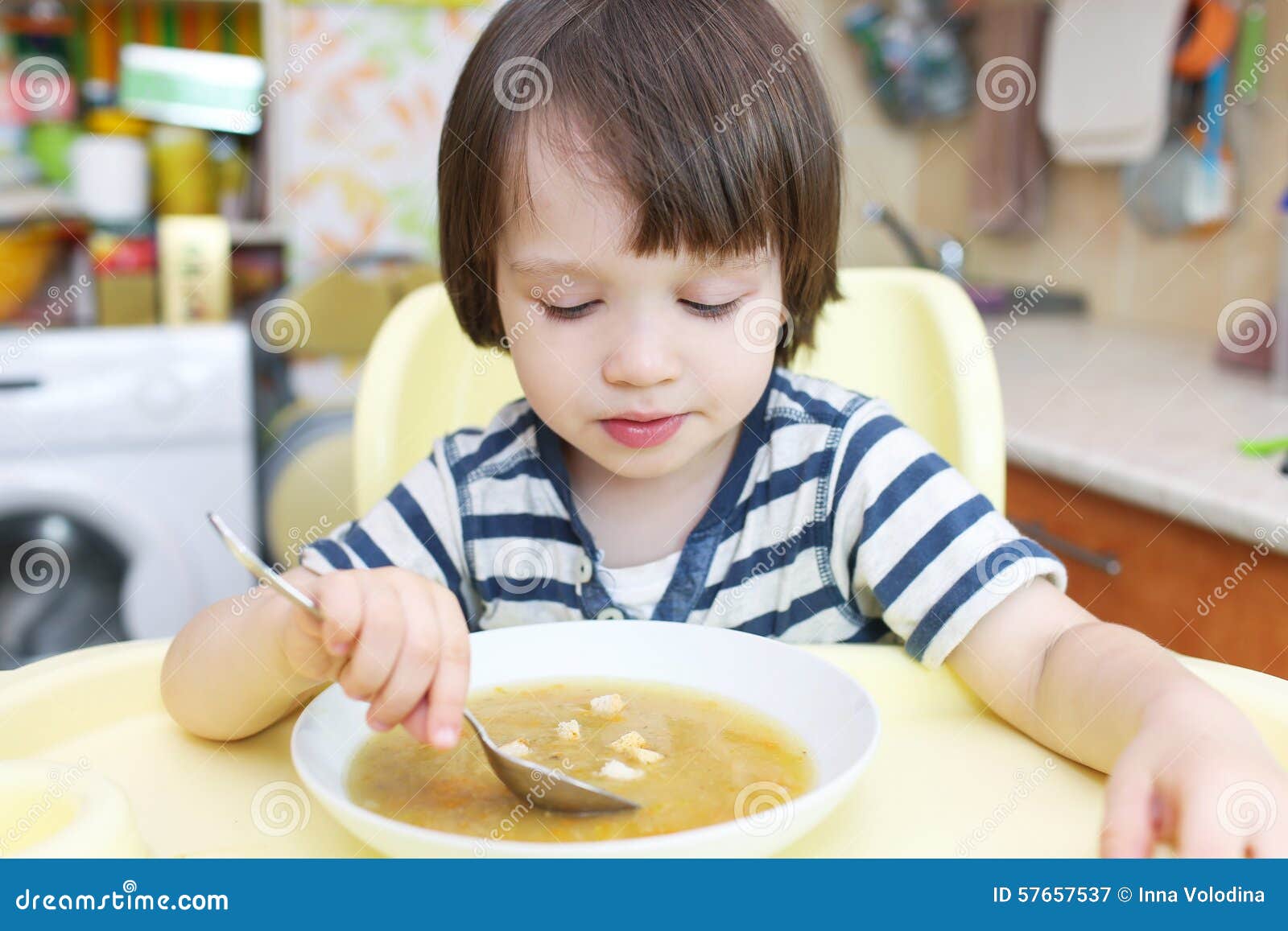 5 Years Old Boy Eats Bread Sticks On White Background, Crispy Snack
