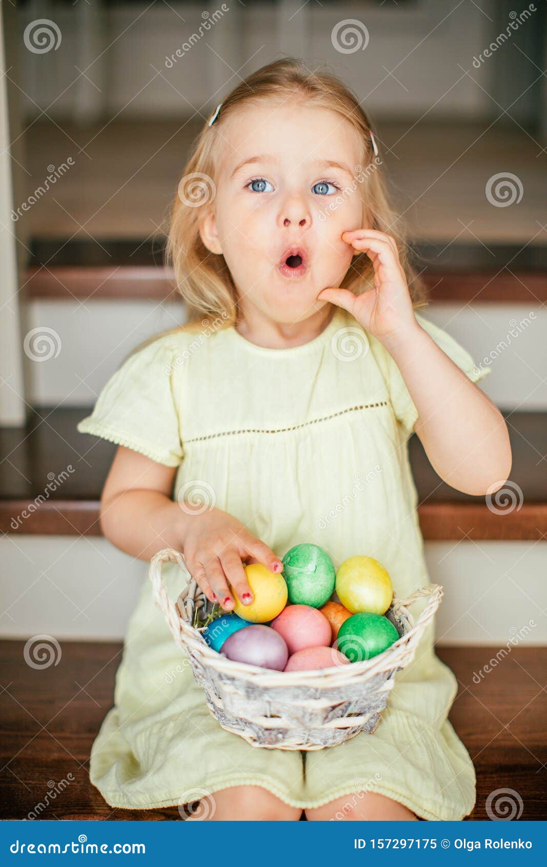 Cute Little Child Girl With Blonde Hair On Easter Day Girl Holding Basket With Painted Eggs And Sitting On The Stairs At Home Stock Image Image Of Easter Home 157297175