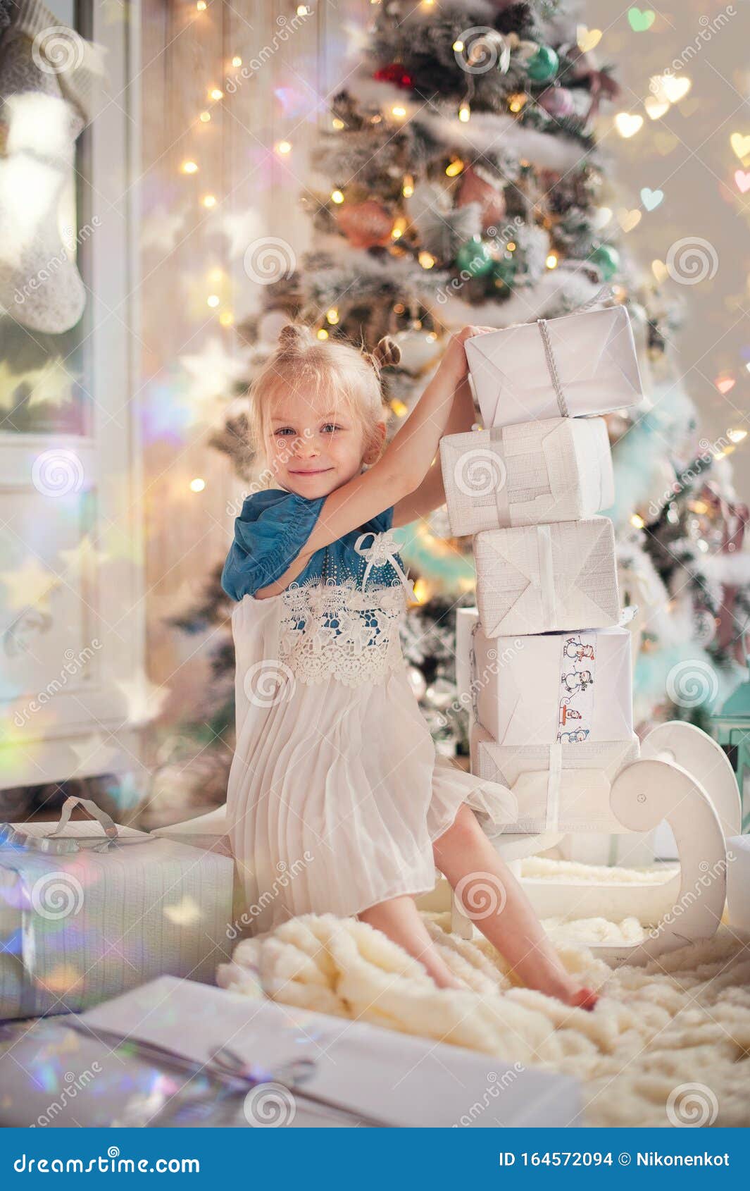 Cute Little Child Girl in Dress Smiling and Having Fun on Bed in White ...