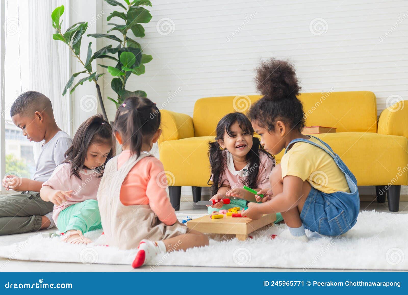 cute little children playing toys in living room, diverse children enjoying playing with toys