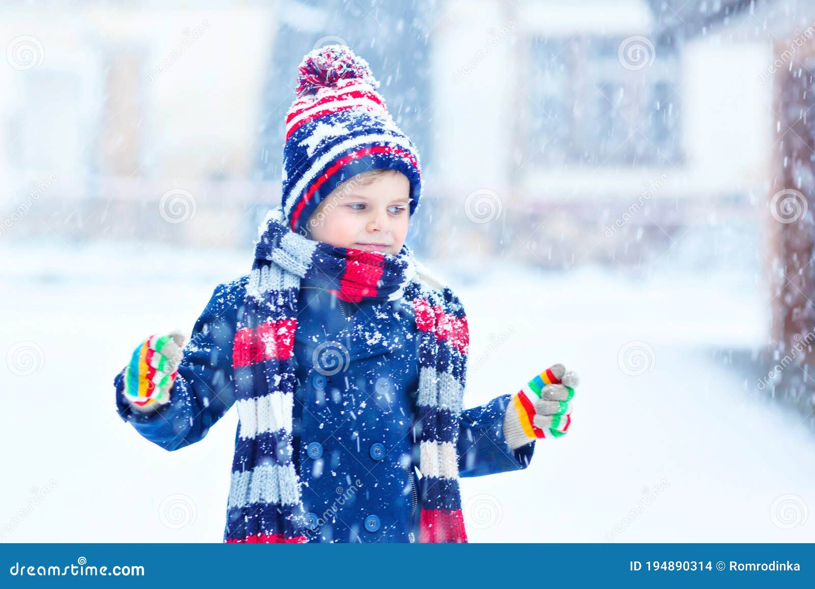 Cute Little Funny Child in Colorful Winter Fashion Clothes Having