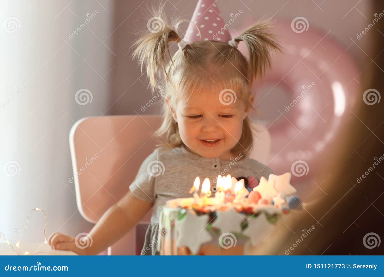 Cute Little Girl with Birthday Cake Sitting on Chair in Room Stock ...