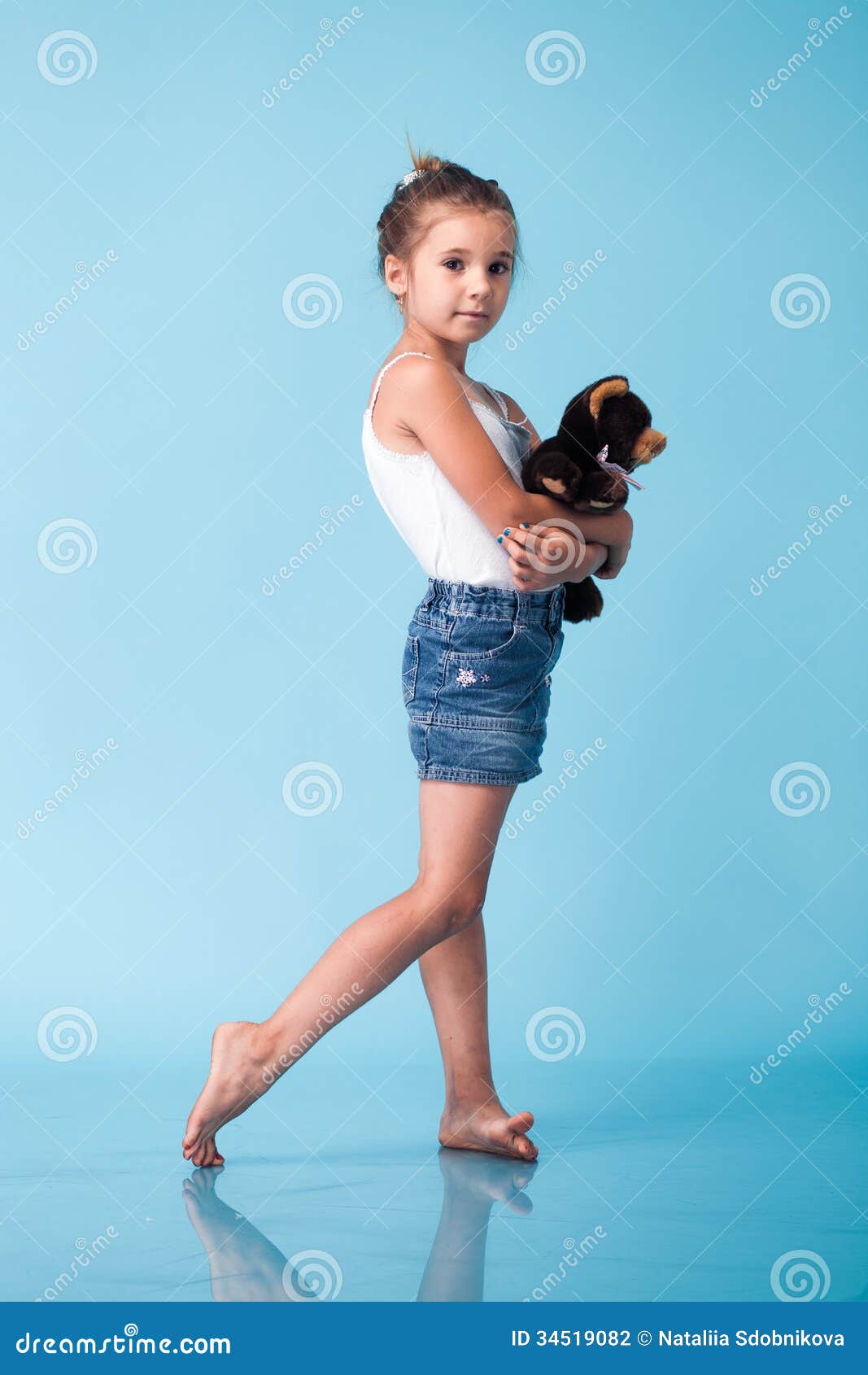 Cute Little Girl on Blue Background Stock Photo - Image of full