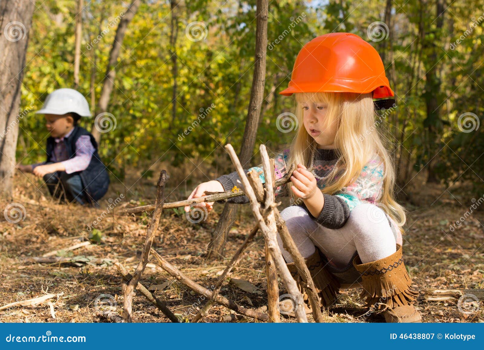 Cute Little Girl Building a Wooden Tepee Stock Image - Image of ...