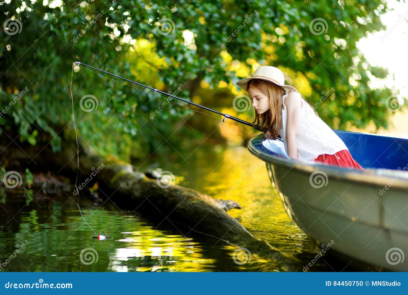 Cute Little Girl Having Fun in a Boat by a River Stock Photo - Image of reel,  calm: 84450750