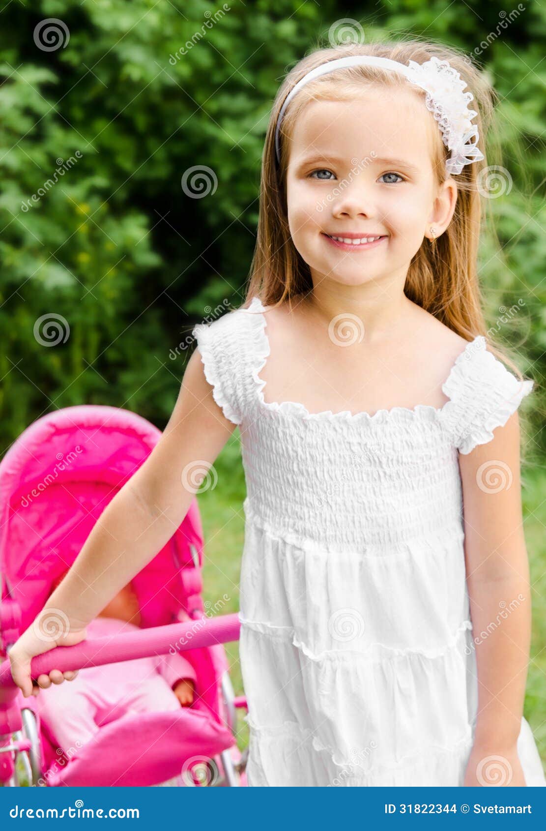 Cute Little Girl with Her Toy Carriage and Doll Stock Photo - Image of ...