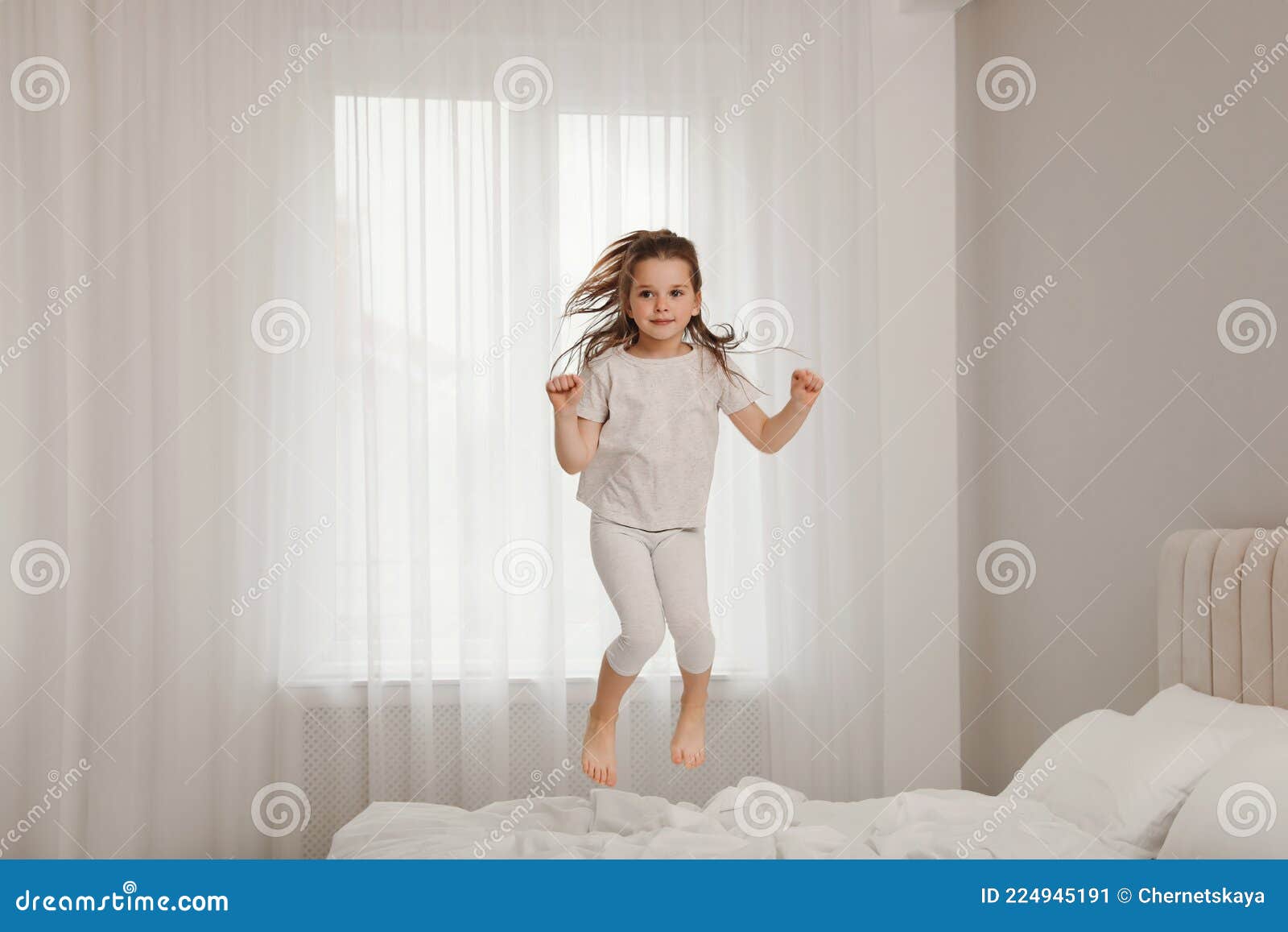 Cute Little Girl Jumping on Bed at Home Stock Image Image of girl