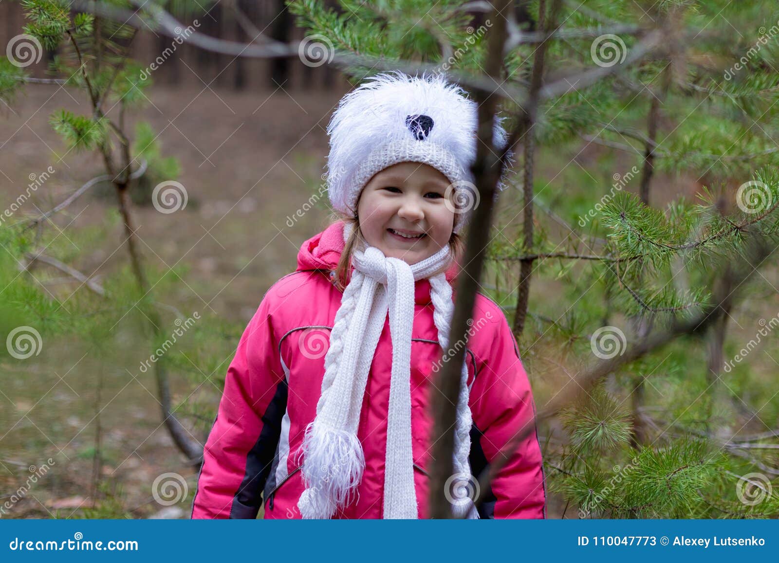 A Cute Little Girl in a Pine Forest in the Autumn Time. Stock Image ...