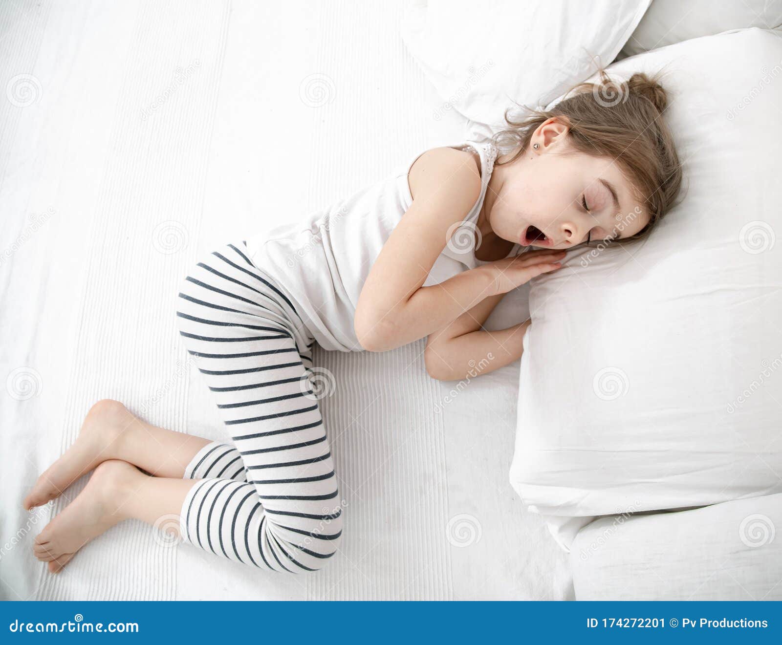 A Cute Little Girl is Sleeping in a White Bed Stock Image - Image of ...