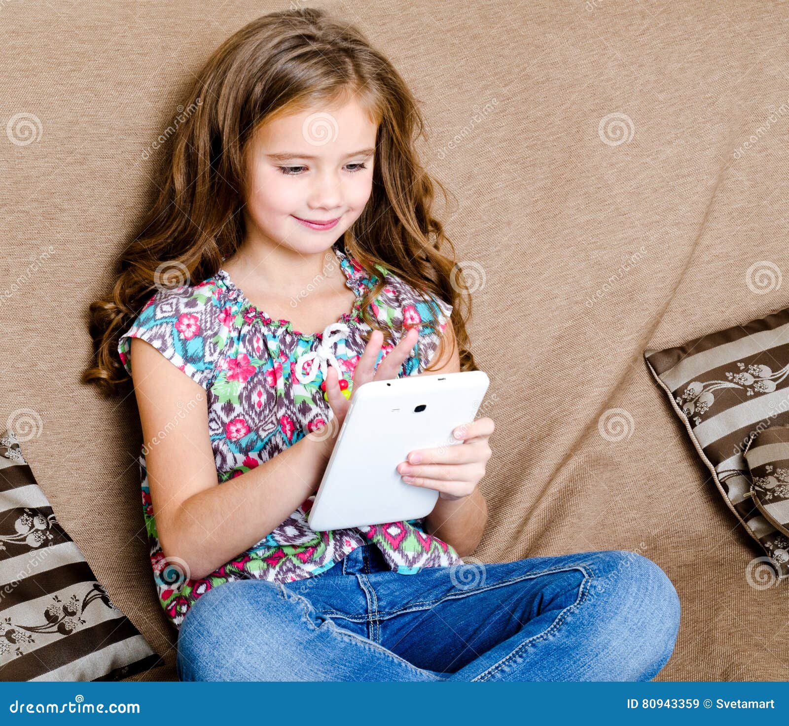 Cute Little Girl with Tablet Pc on the Sofa Stock Image - Image of ...