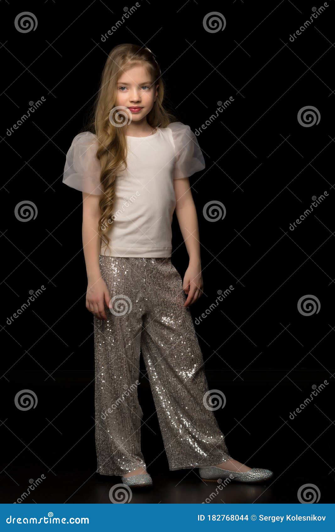 Cute Little Girl in a Pantsuit. Isolated on a Black Background. Stock Photo  - Image of little, lovely: 182768044