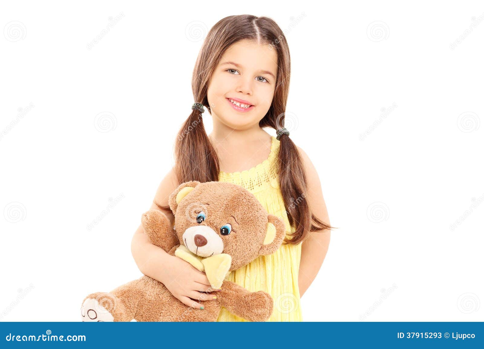 Cute Little Girl in Yellow Dress Holding a Teddy Bear Stock Image ...