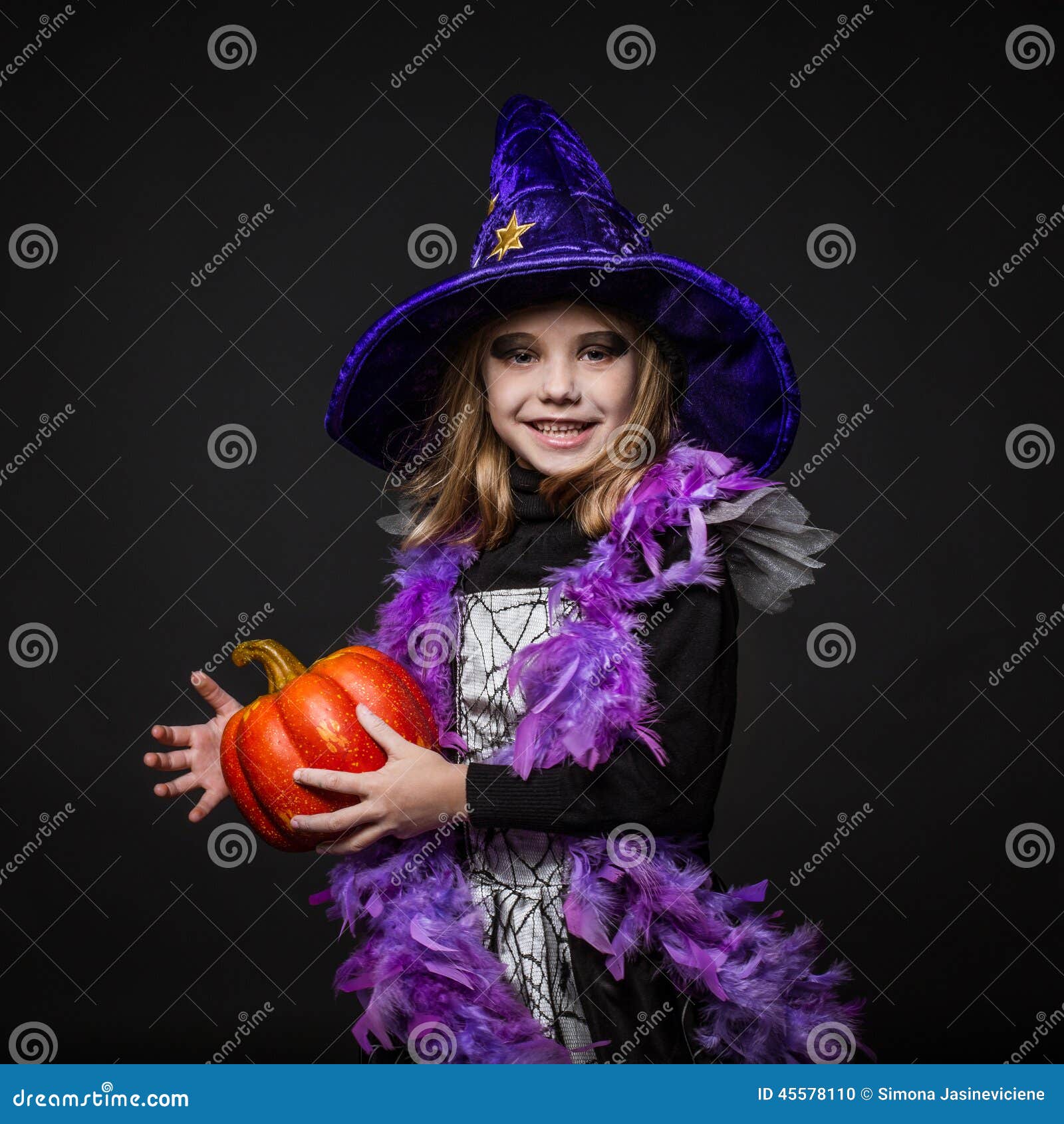 Cute Little Halloween Witch Holding A Orange Pumpkin Stock Photo ...