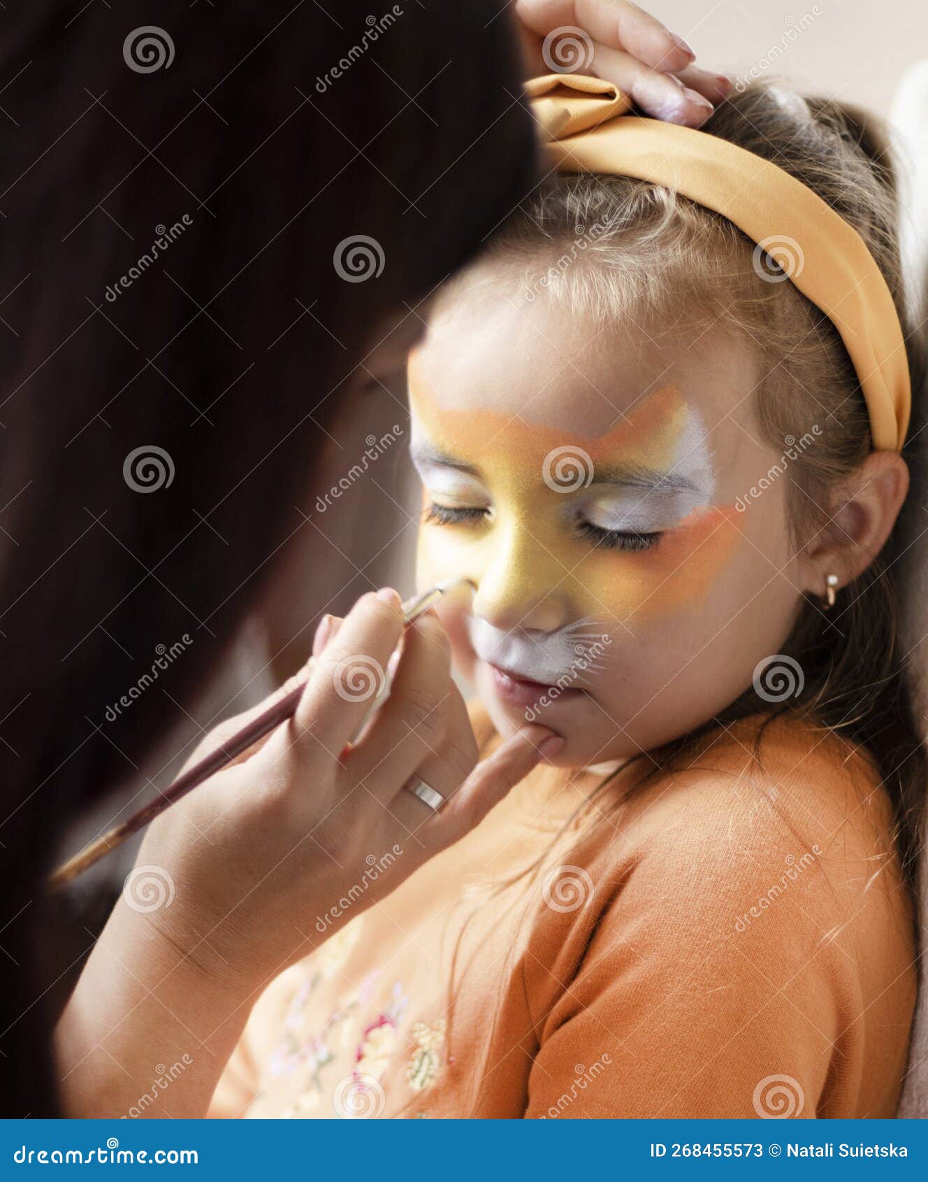 Cute Makeup Little Tiger. Girl Getting Face Painting Outdoors
