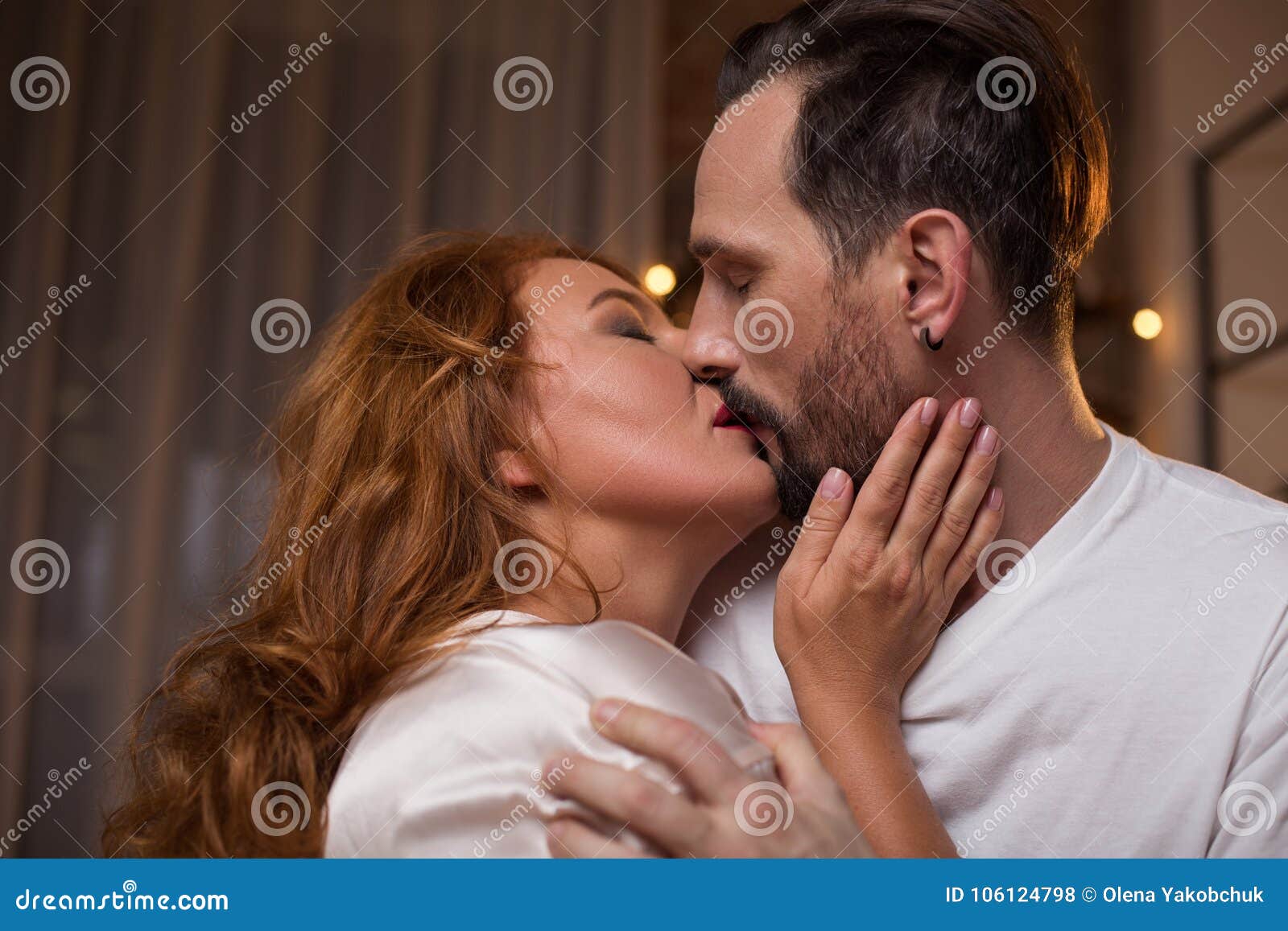 Sensual Woman Enjoying Kiss of Her Lover Stock Photo