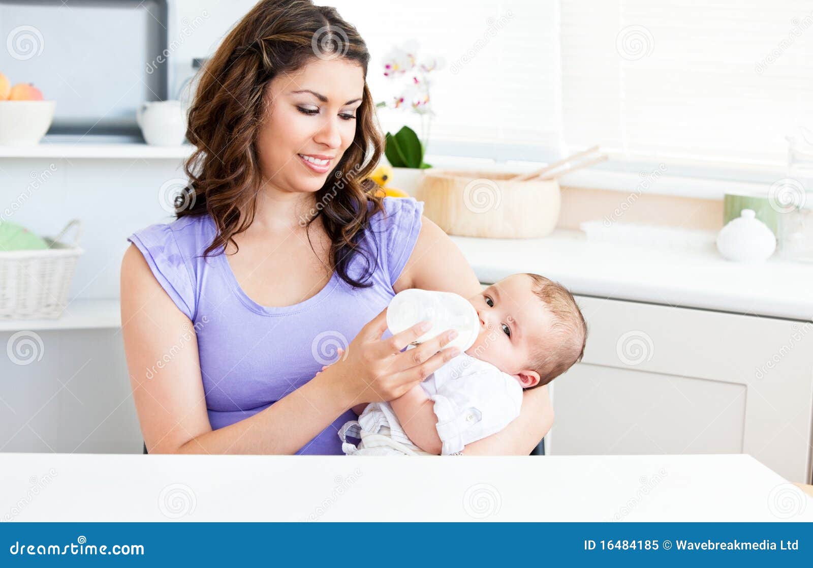 Cute Mother Feeding Her Baby in the Kitchen Stock Image Image of