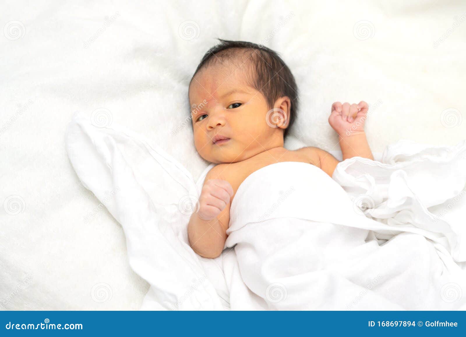 Cute Newborn Baby Girl in White Blanket OnÂ nurseryÂ bed.Â ...