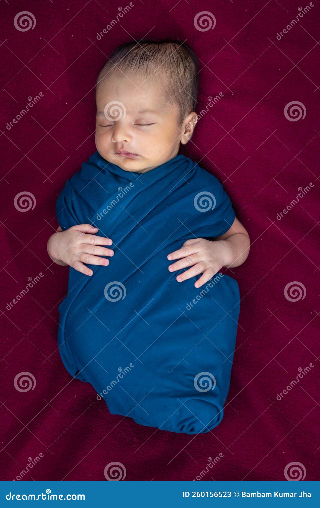 Cute Newborn Baby Sleeping in Baby Wrap Top Angle Shot Stock Image