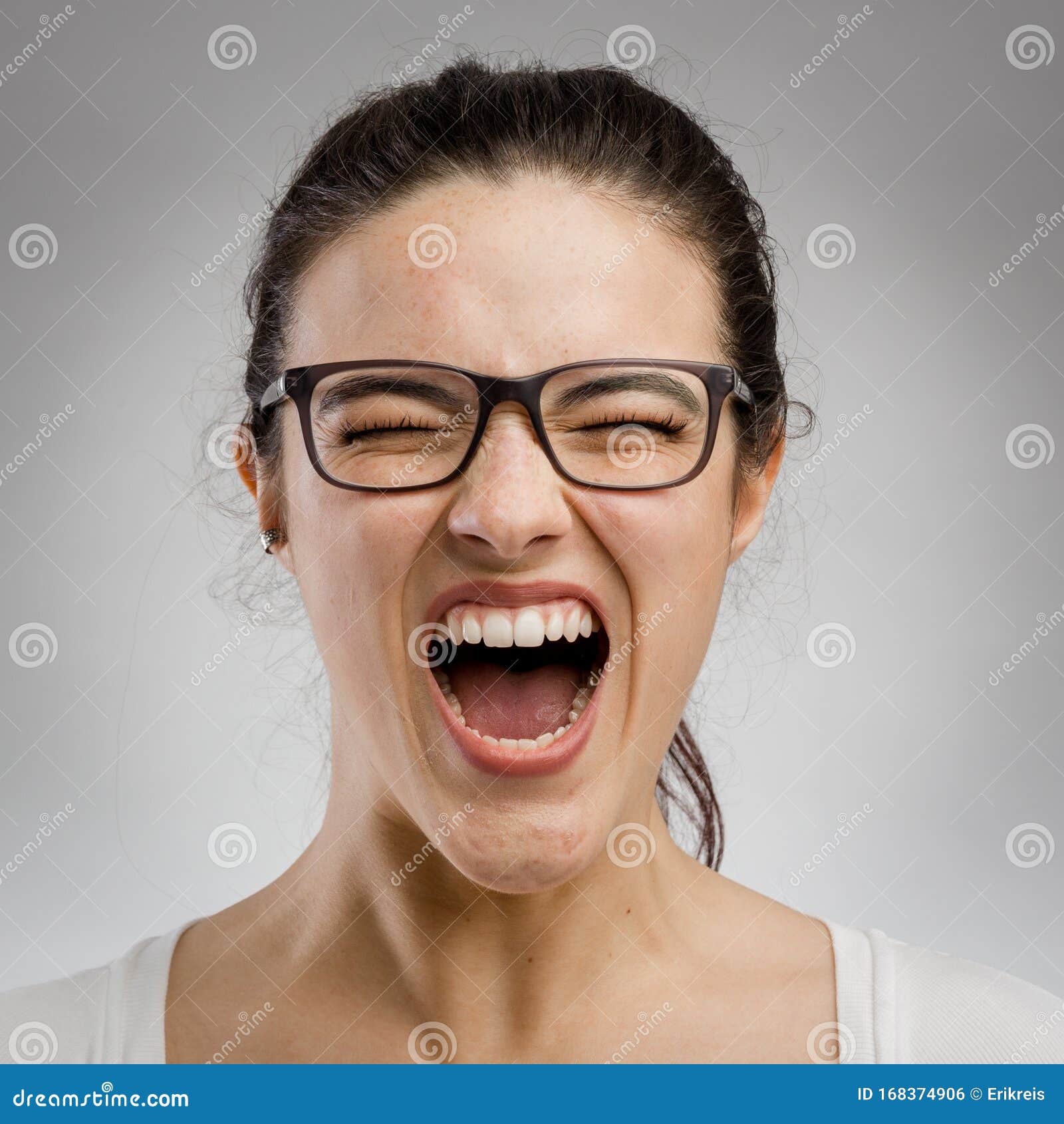 woman yelling on grey background