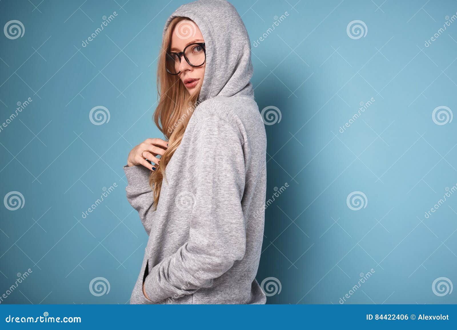 Cute Positive Blonde Woman in Gray Hoodie and Glasses Stock Photo ...