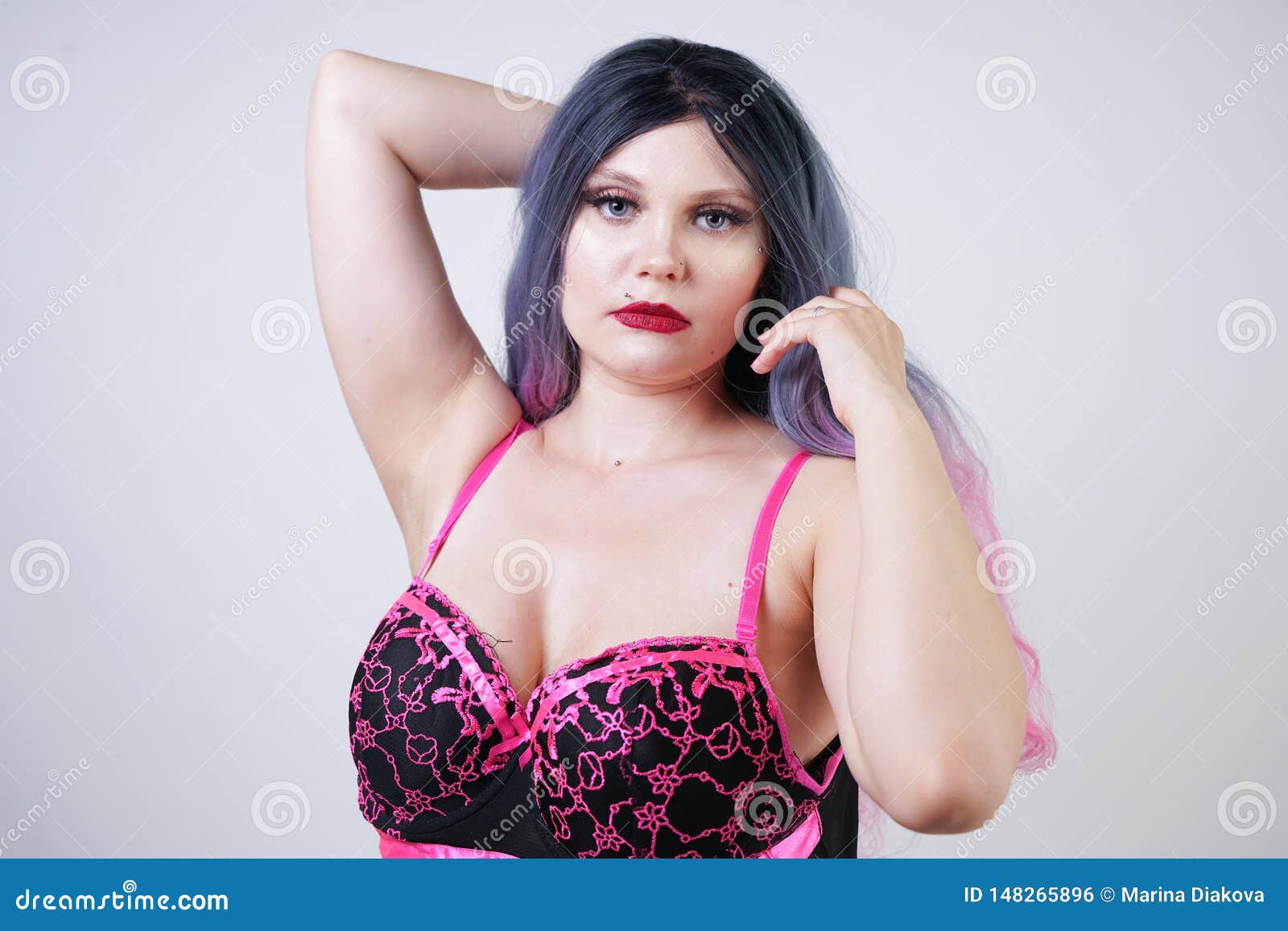 Cute Pretty Chubby Lady Wearing Sexual Babydoll Lingerie Dress on White Studio Background Stock Photo photo picture