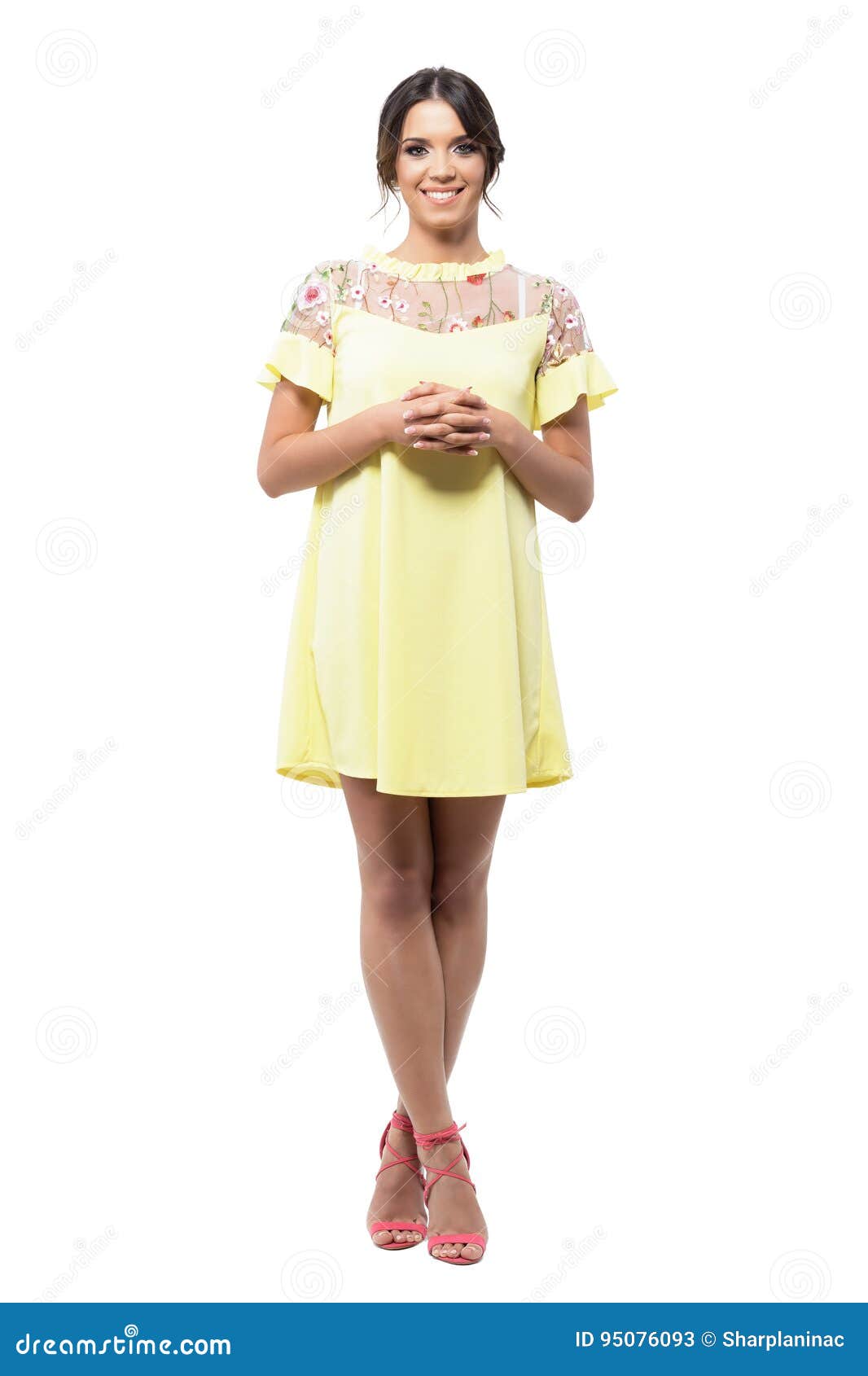 Cute Pretty Smiling Woman In Yellow Dress Standing With Clasped Hands ...