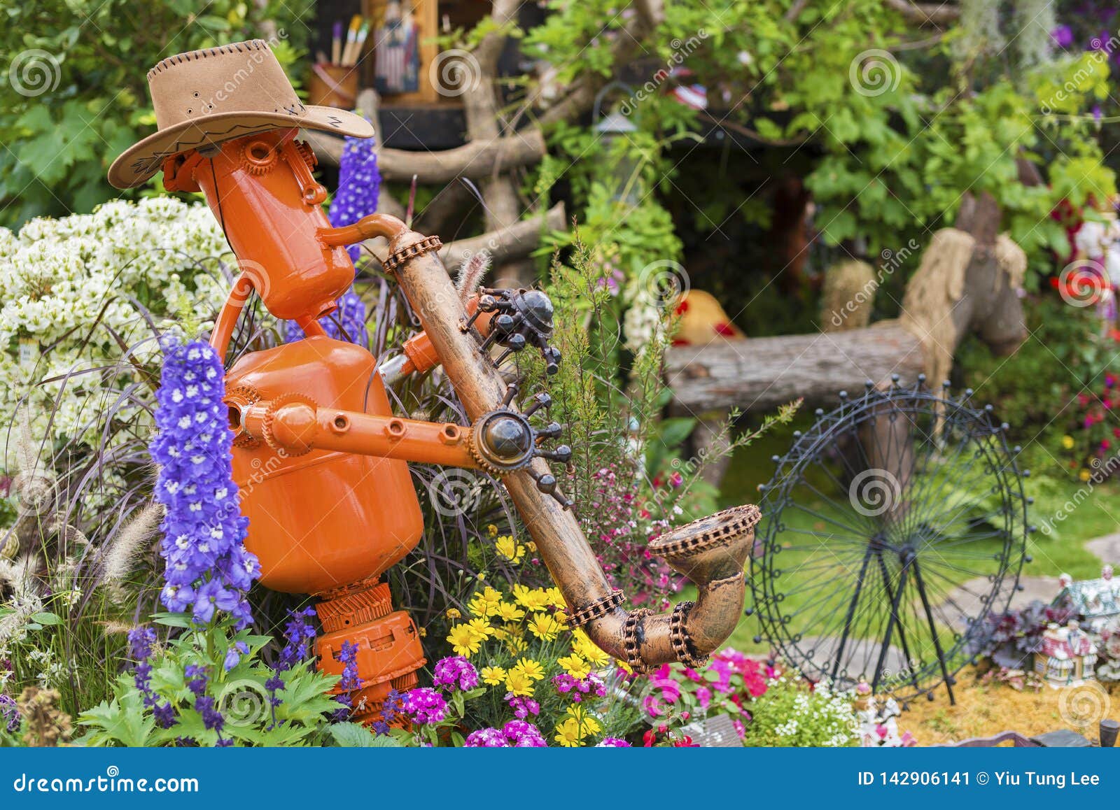 Scarecrow in flower garden stock image. Image of fairytale - 142906141