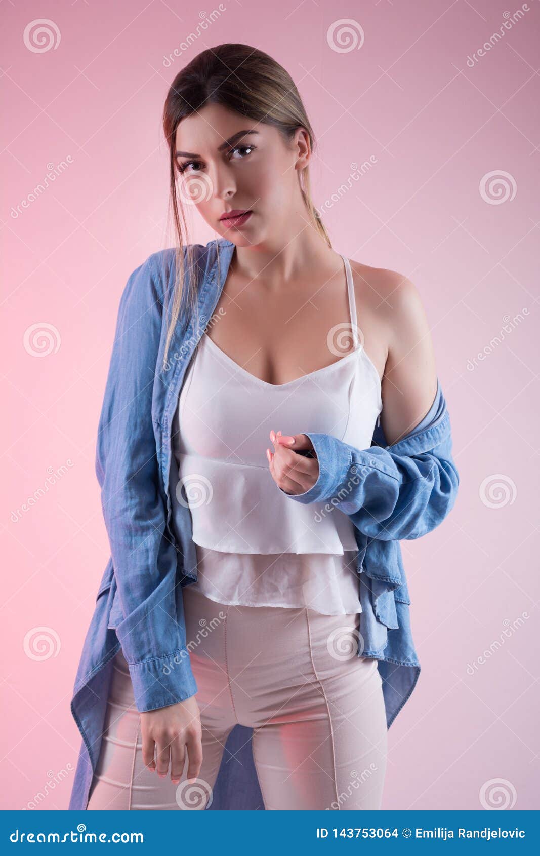 Beautiful woman posing in bra and jeans Stock Photo by ©rilueda