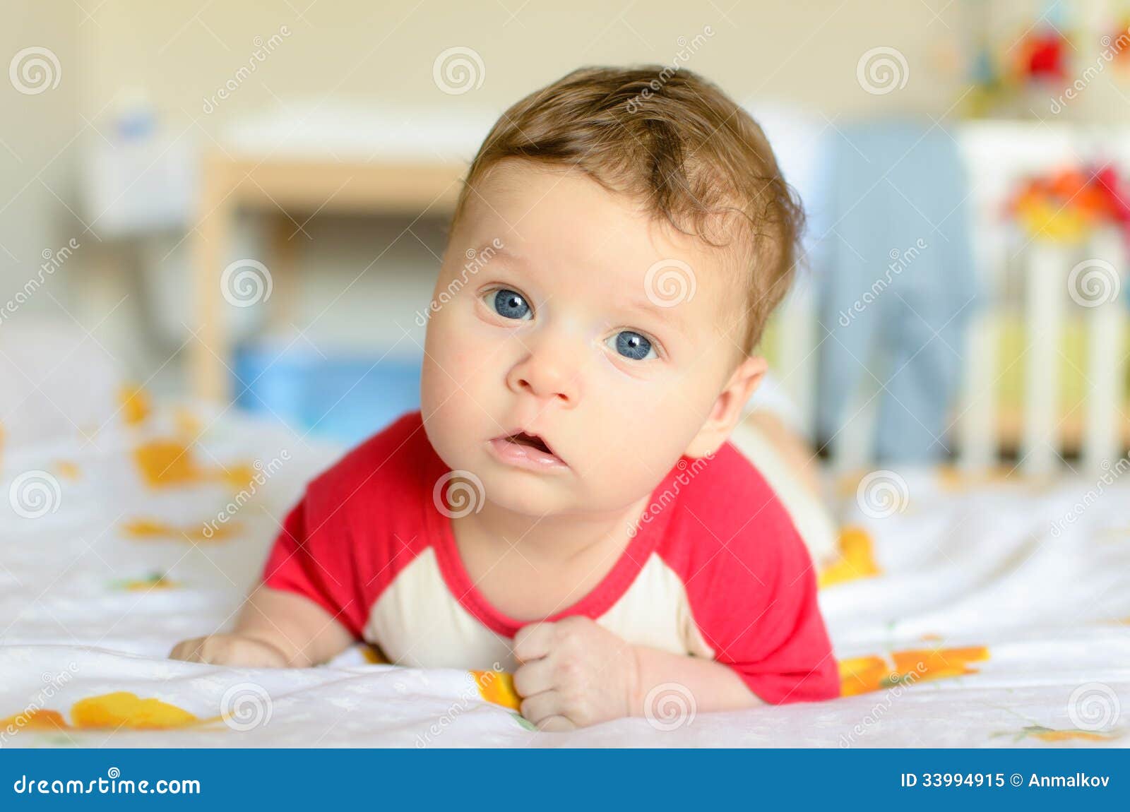 Serious Baby Lies On His Tummy Serious Baby Lies On His Tummy Stock Image Image Of