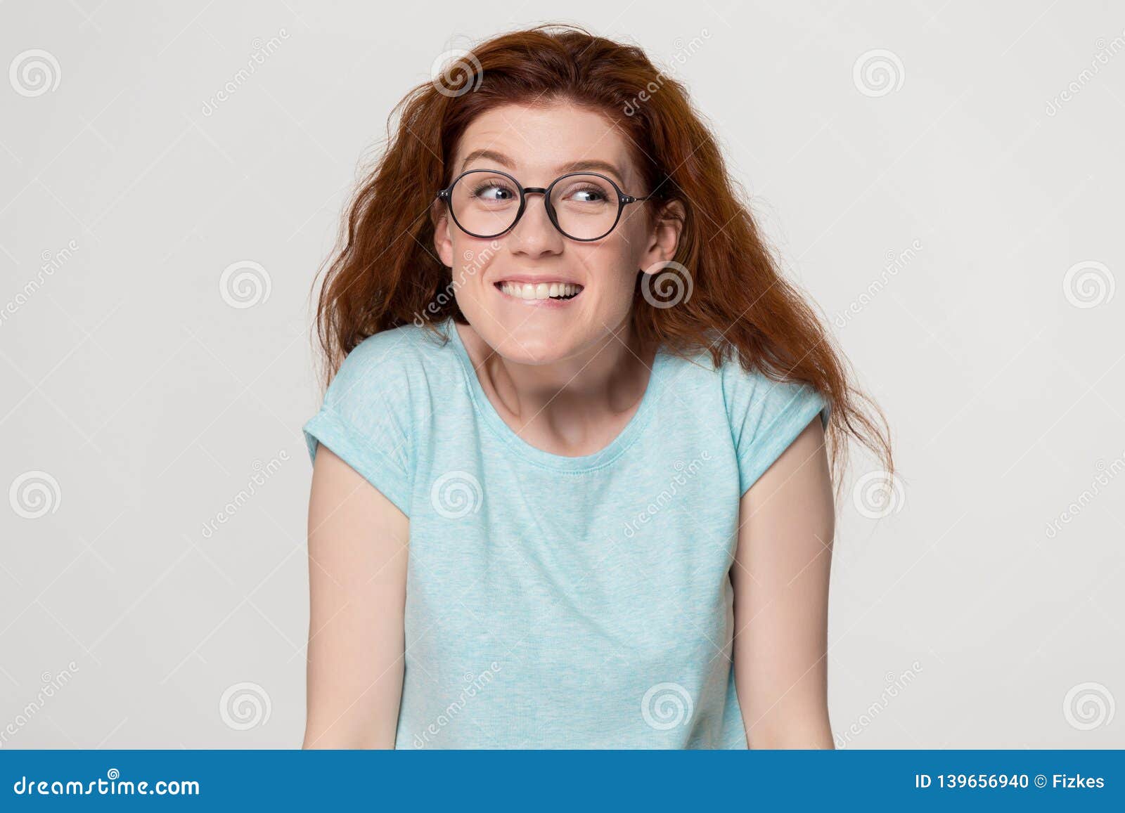 Cute Shy Redhead Girl In Glasses Biting Lips Feeling Embarrassed Stock