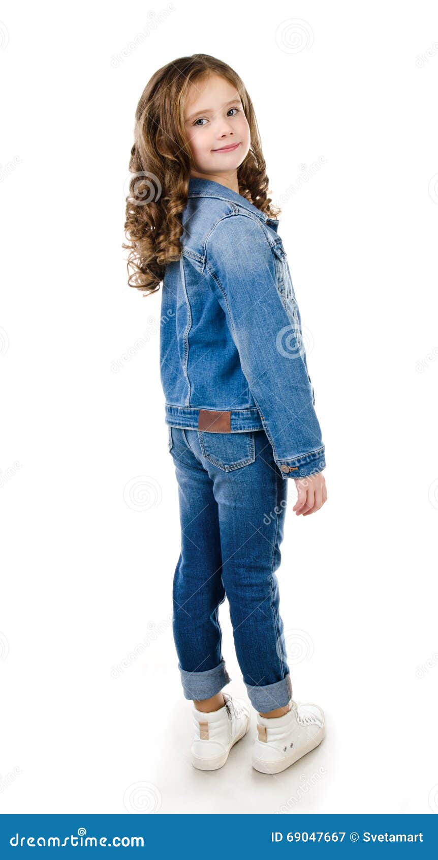 Cute Smiling Little Girl in Jeans Isolated Stock Image - Image of hands ...