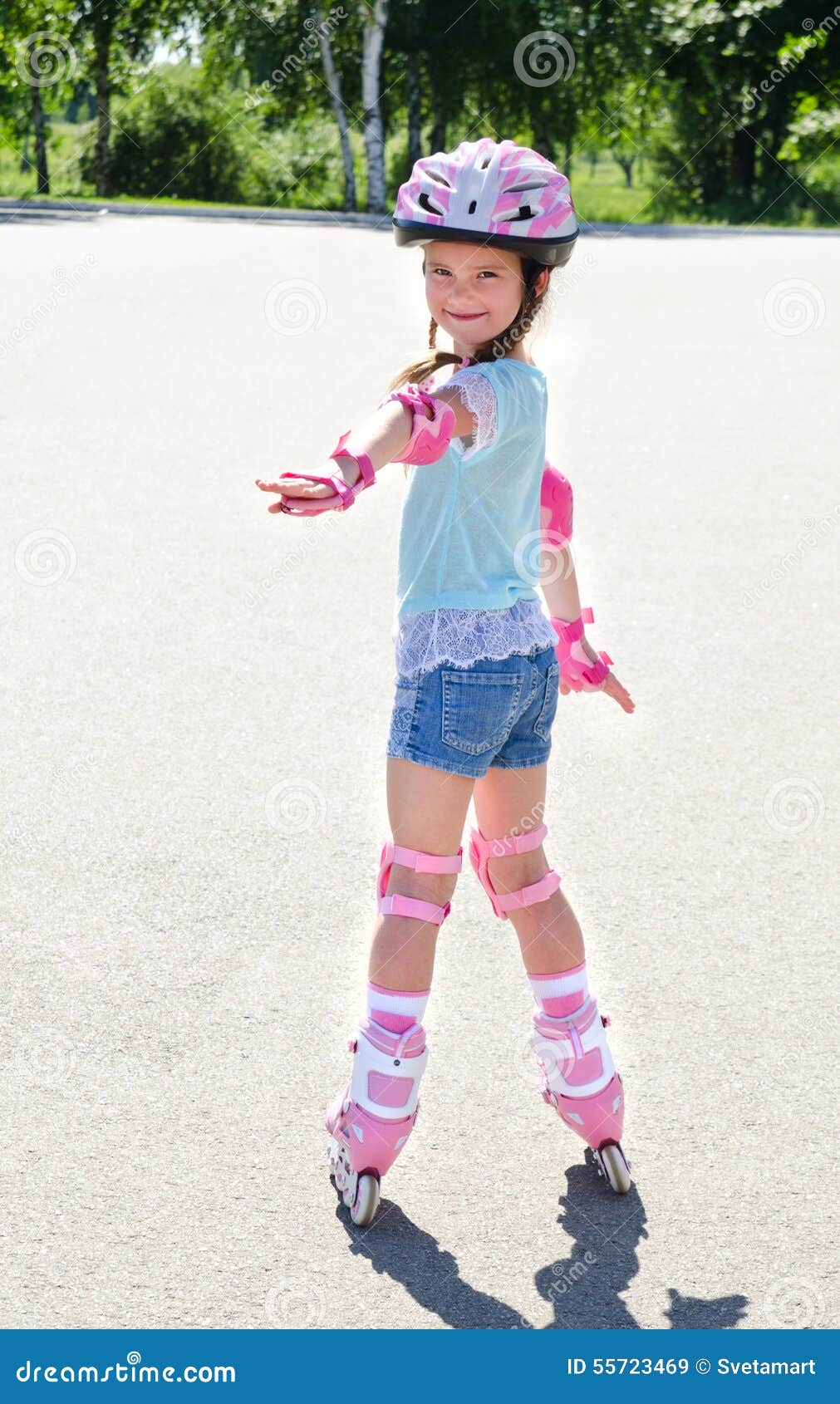Cute Smiling Little Girl In Pink Roller Skates Stock Image - Image of