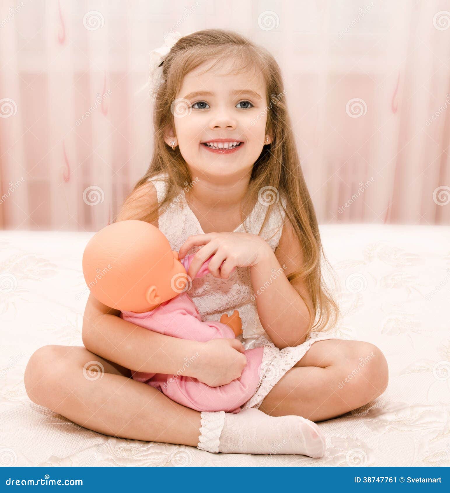 little girls playing with baby dolls