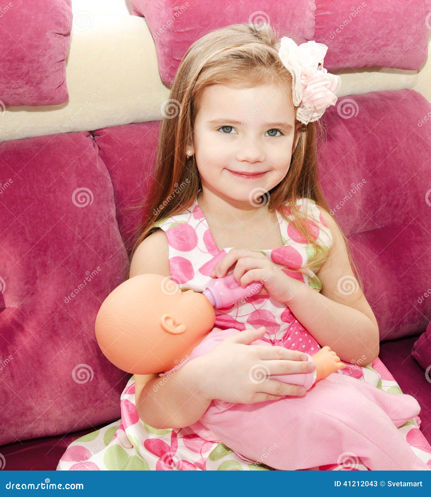 Cute Smiling Little Girl Playing With A Doll Stock Image ...