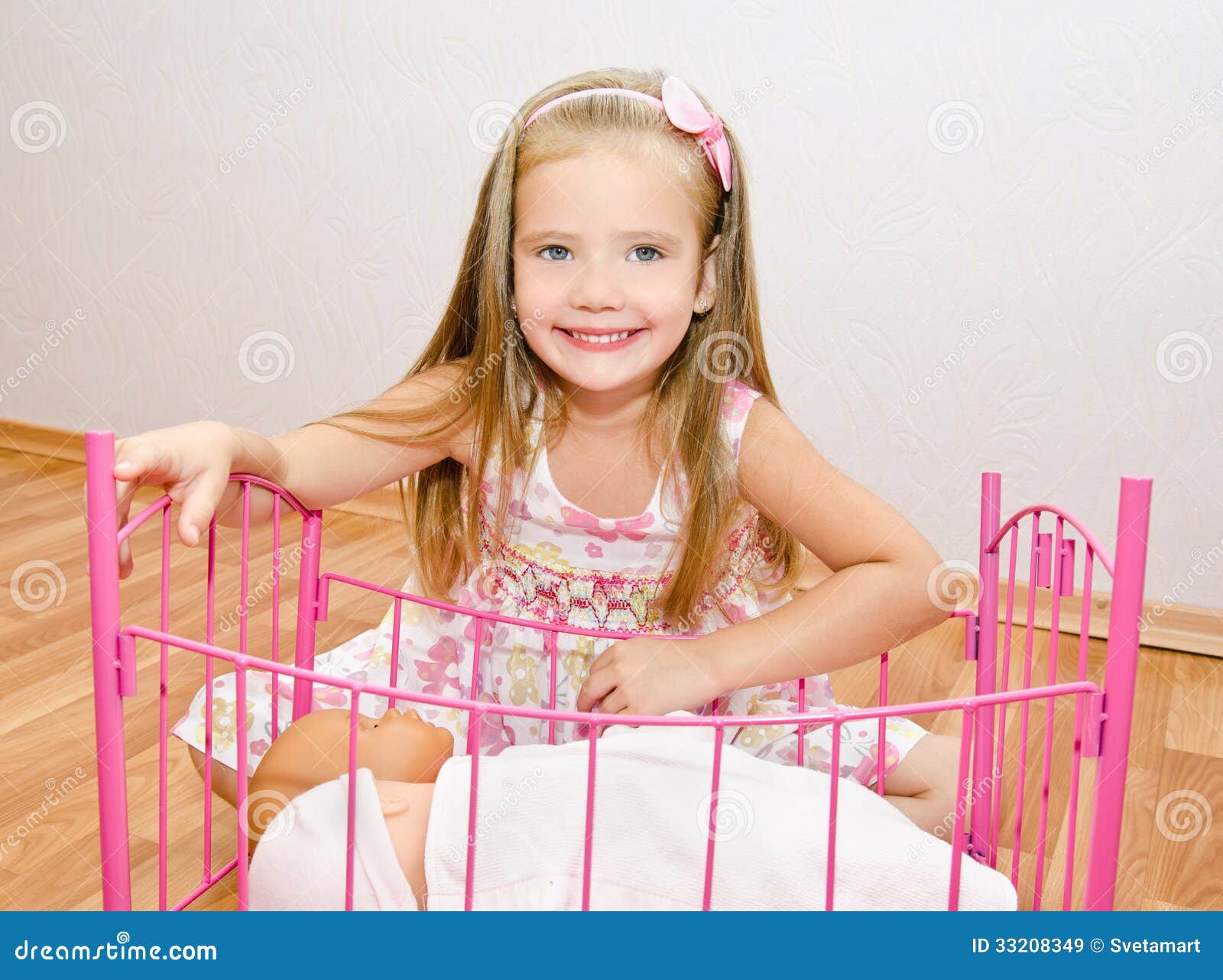 little girls playing with baby dolls