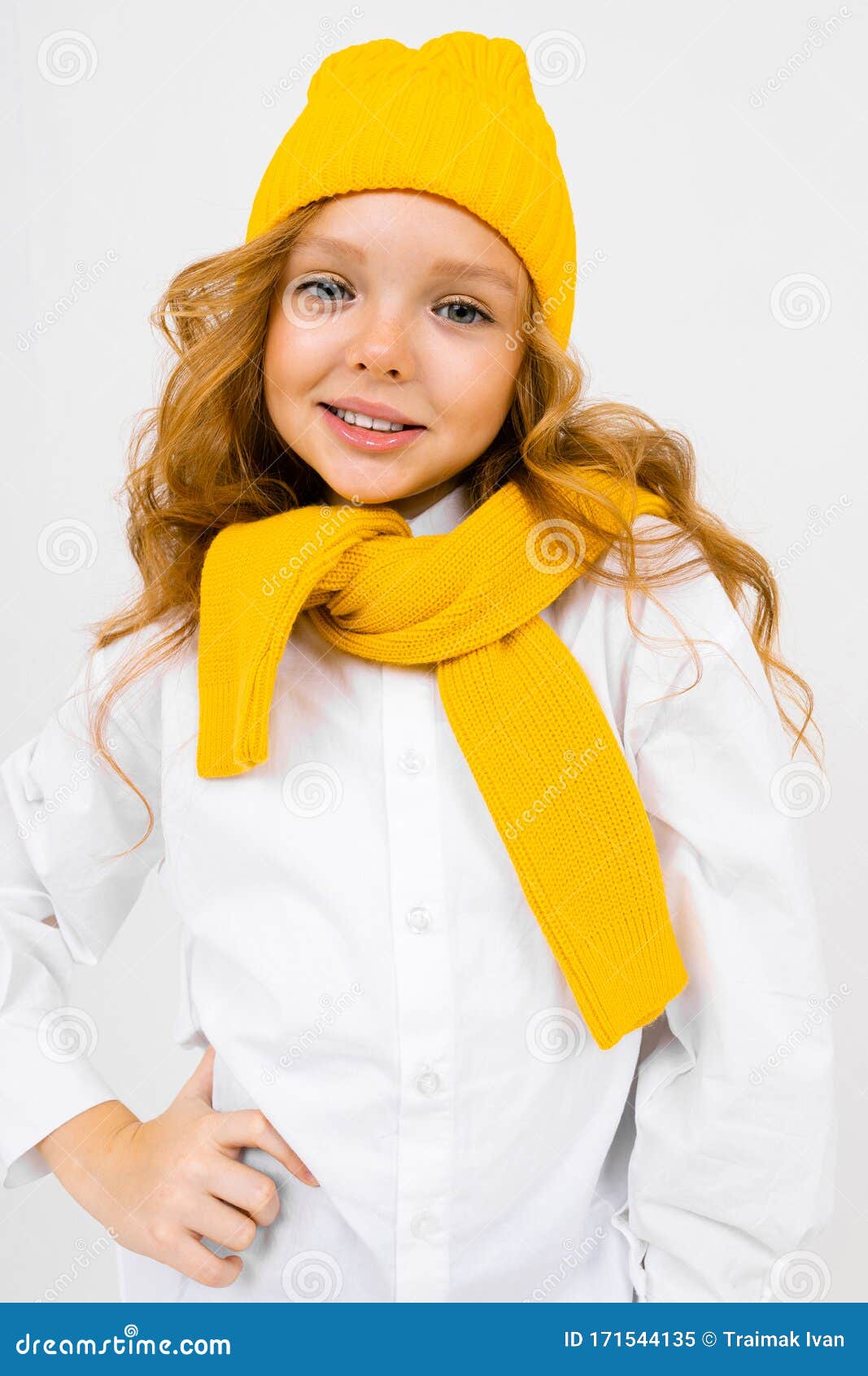 Cute Smiling Teenager Girl in a Yellow Hat with a Scarf on a White ...