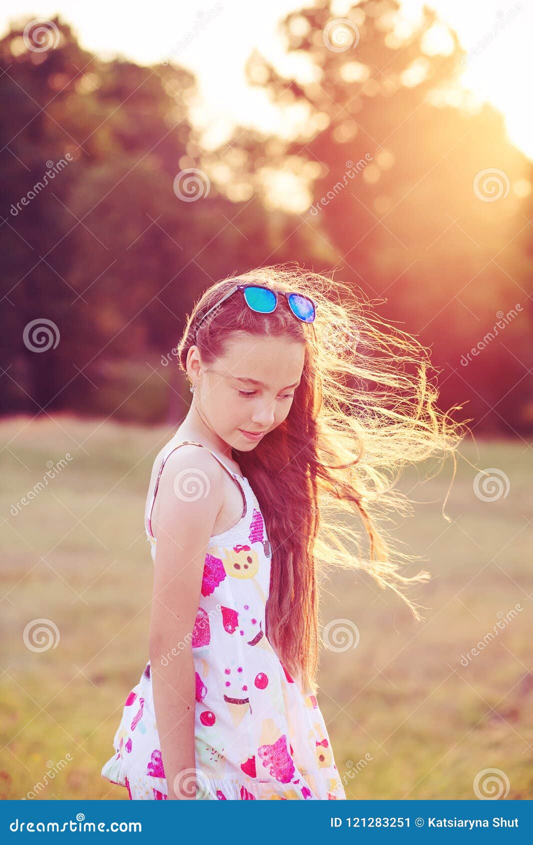 Beautiful Teen Girl Is Dancing In The Park At Summer Sunset