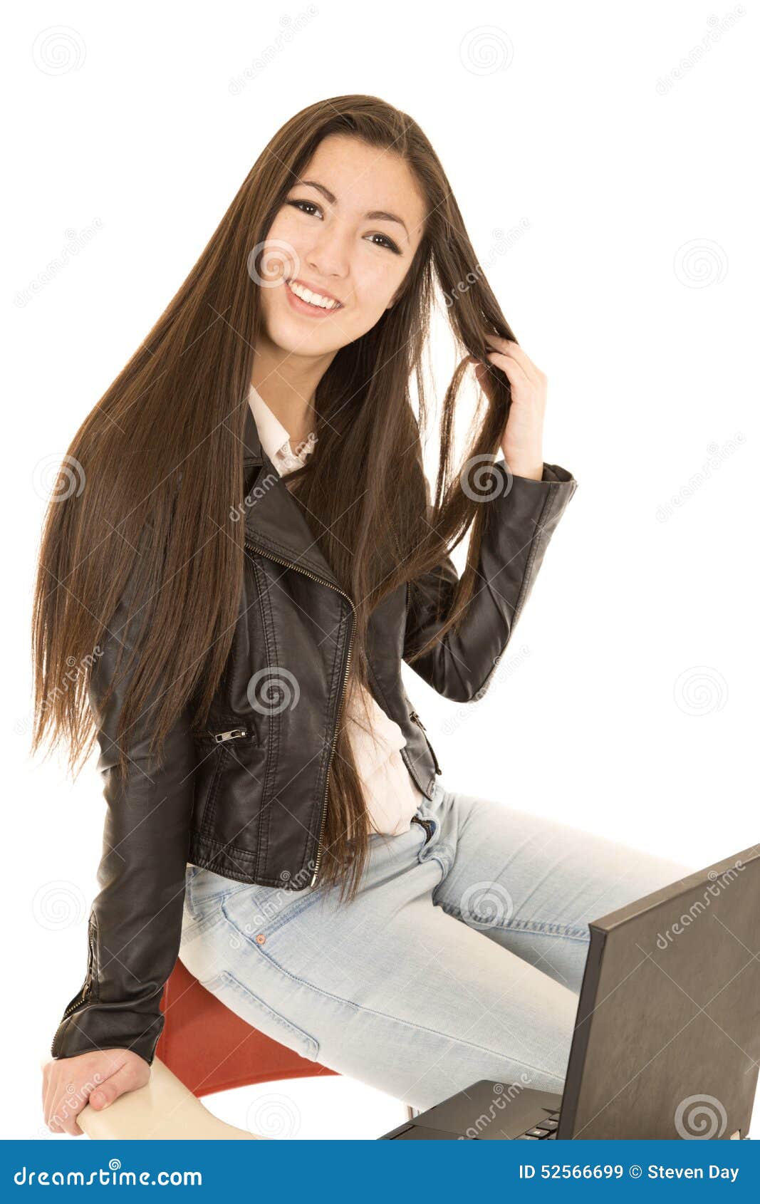 Cute Teen Girl Sitting On The Back Of Her School Desk Chair With