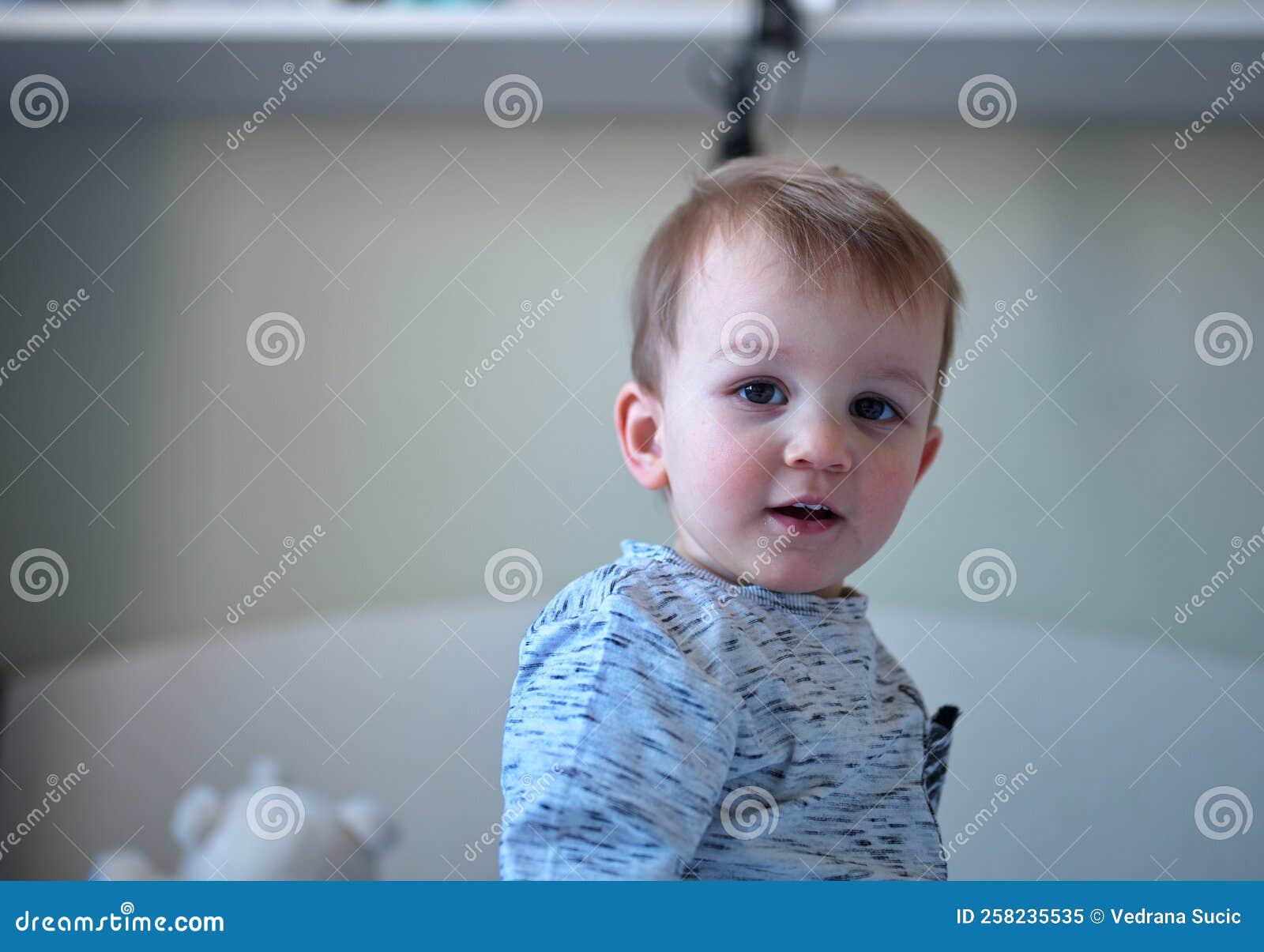 Cute toddler on the bed stock image. Image of human 258235535