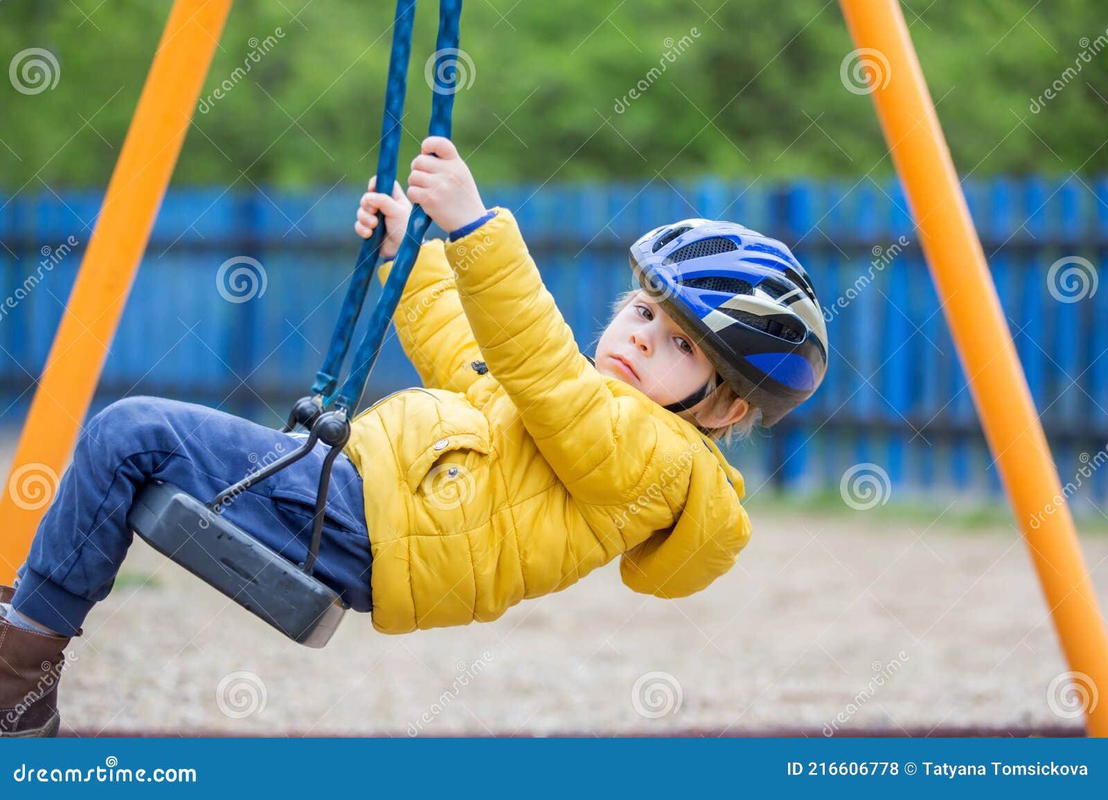 cute toddler boy, playing on the playground