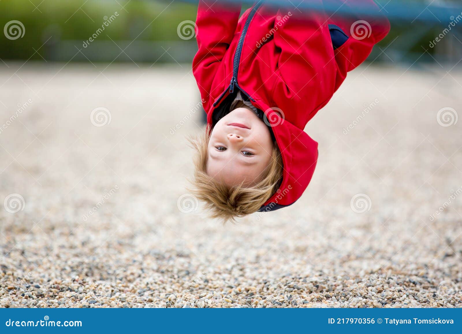 cute toddler boy, playing on the playground